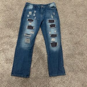 Distressed Blue Jeans with Black Patches